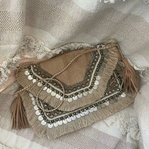 Never been used;Shashi brand, boho, coin-embellished oversized crossbody/clutch.
